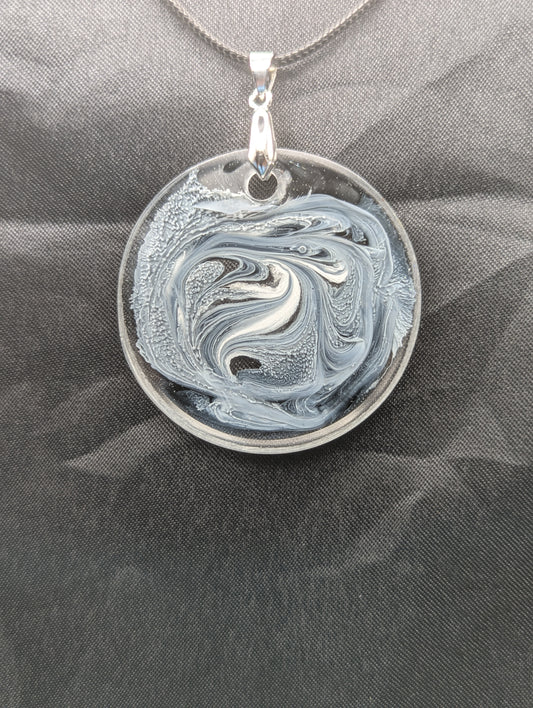 Black & White Swirl Circle Pendant on a silver pinch bail & waxed cotton cord. Resin Circle Jewelry Pendant with Petri Effect.