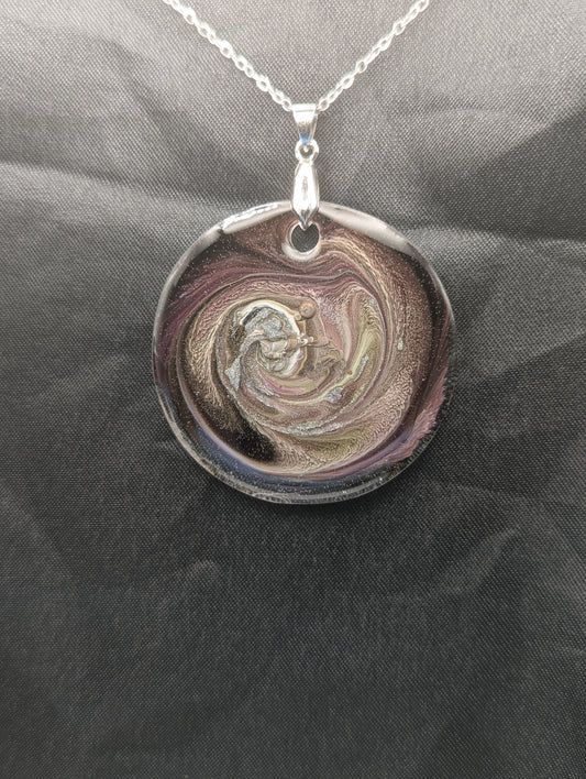 Purple Swirl Circle Pendant with shades of purple, yellow, & black on a silver pinch bail & silver plated stainless steel chain. Resin Circle Jewelry Pendant with Petri Effect.