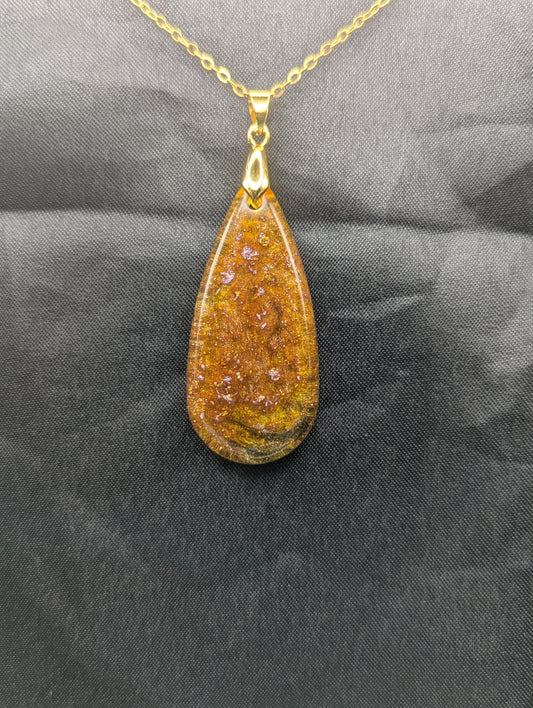 Yellow & Purple colored Teardrop Resin Pendant necklace with a gold pinch bail on a gold plated metal chain.