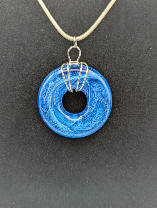 Wire Wrapped Donut Resin Pendant Necklace - Petri Effect with shades of blue. Resin Necklace on a waxed cotton cord.