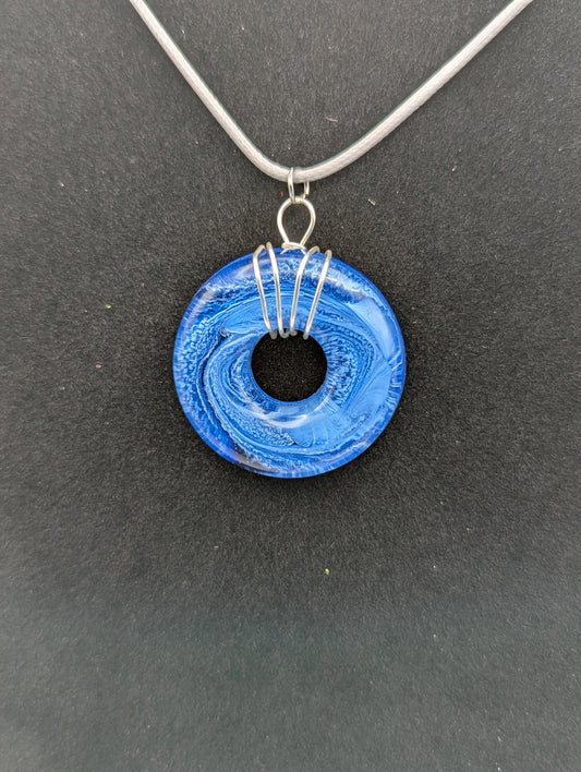 Wire Wrapped Donut Resin Pendant Necklace - Petri Effect with shades of blue swirls. Resin Necklace on a waxed cotton cord.