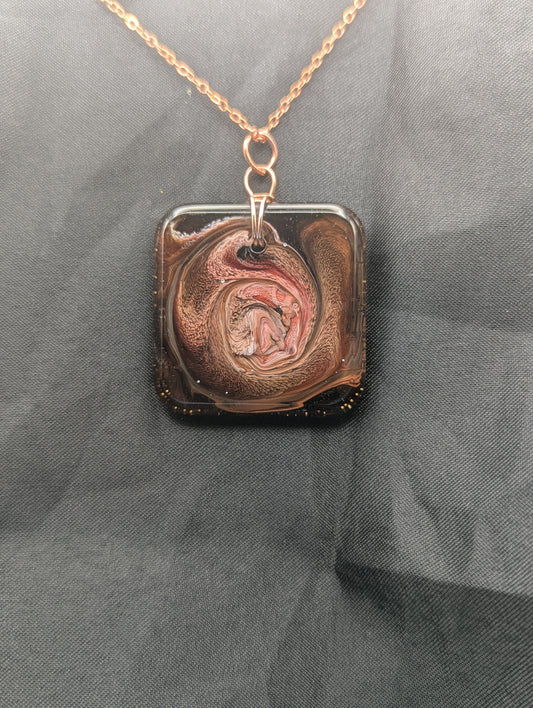 Red & Brown Swirl Square Pendant wrapped in a solid copper wire on a rose gold colored stainless steel plated metal chain. Resin Square Jewelry Pendant with Petri Effect.