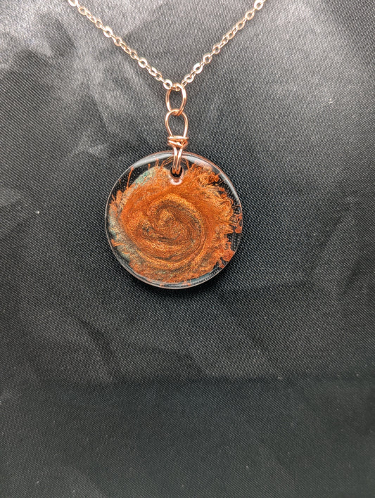 Copper Swirl Circle Resin Pendant wrapped in a pure copper wire on a rose colored stainless steel plated metal chain.