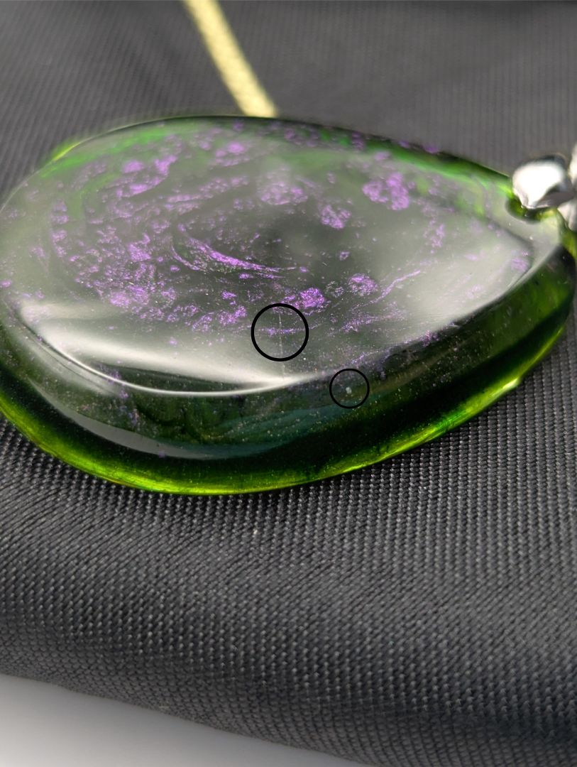 Teardrop Resin Pendant Necklace - Green & sparkly in color with pops of purple. Resin necklace on a waxed cotton cord.