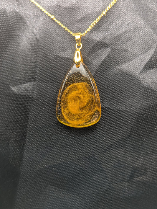 Yellow & Orange Swirl Rounded Triangle Resin Pendant Necklace on a gold pinch bail and a gold plated metal chain.