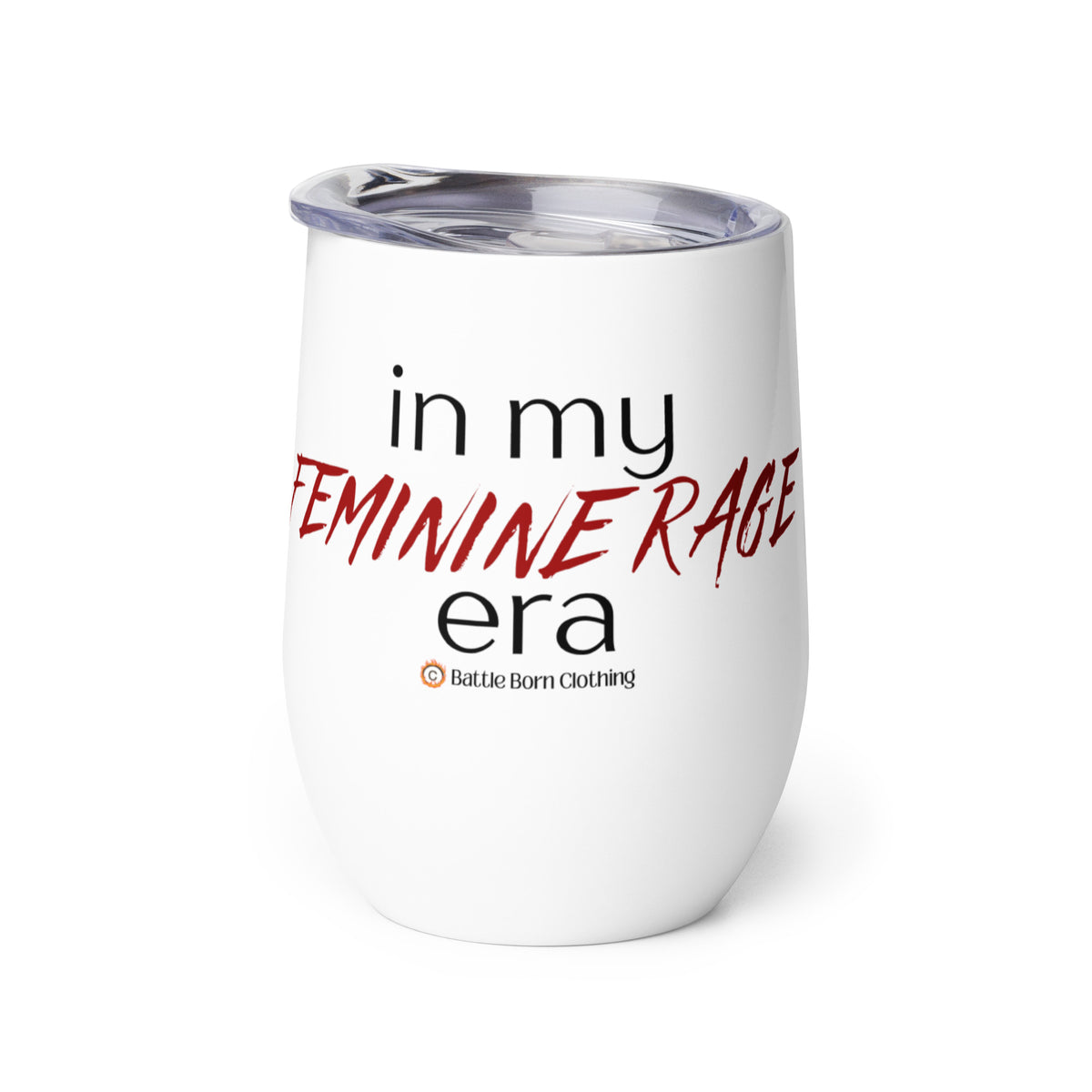 An insulated stemless wine glass with a lid for drinking wine in a tumbler. Cup is white in color with the words "in my feminine rage era". The words "feminine rage" are in red & a different font than the other words (other words are in black)