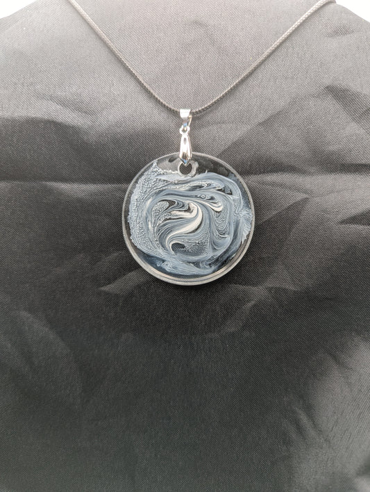 Black & White Swirl Circle Pendant on a silver pinch bail & waxed cotton cord. Resin Circle Jewelry Pendant with Petri Effect.