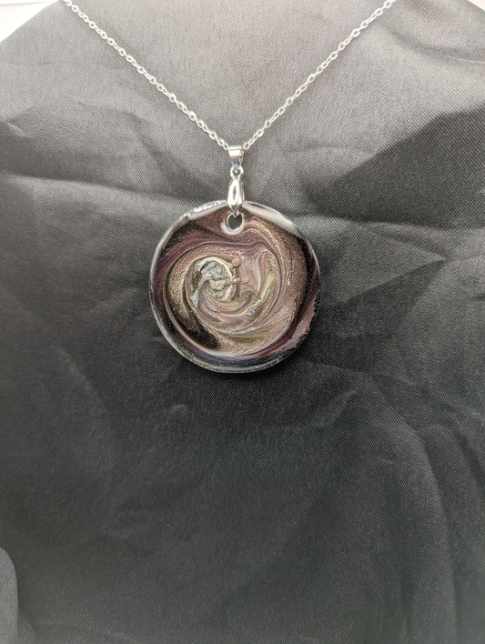Purple Swirl Circle Pendant with shades of purple, yellow, & black on a silver pinch bail & silver plated stainless steel chain. Resin Circle Jewelry Pendant with Petri Effect.