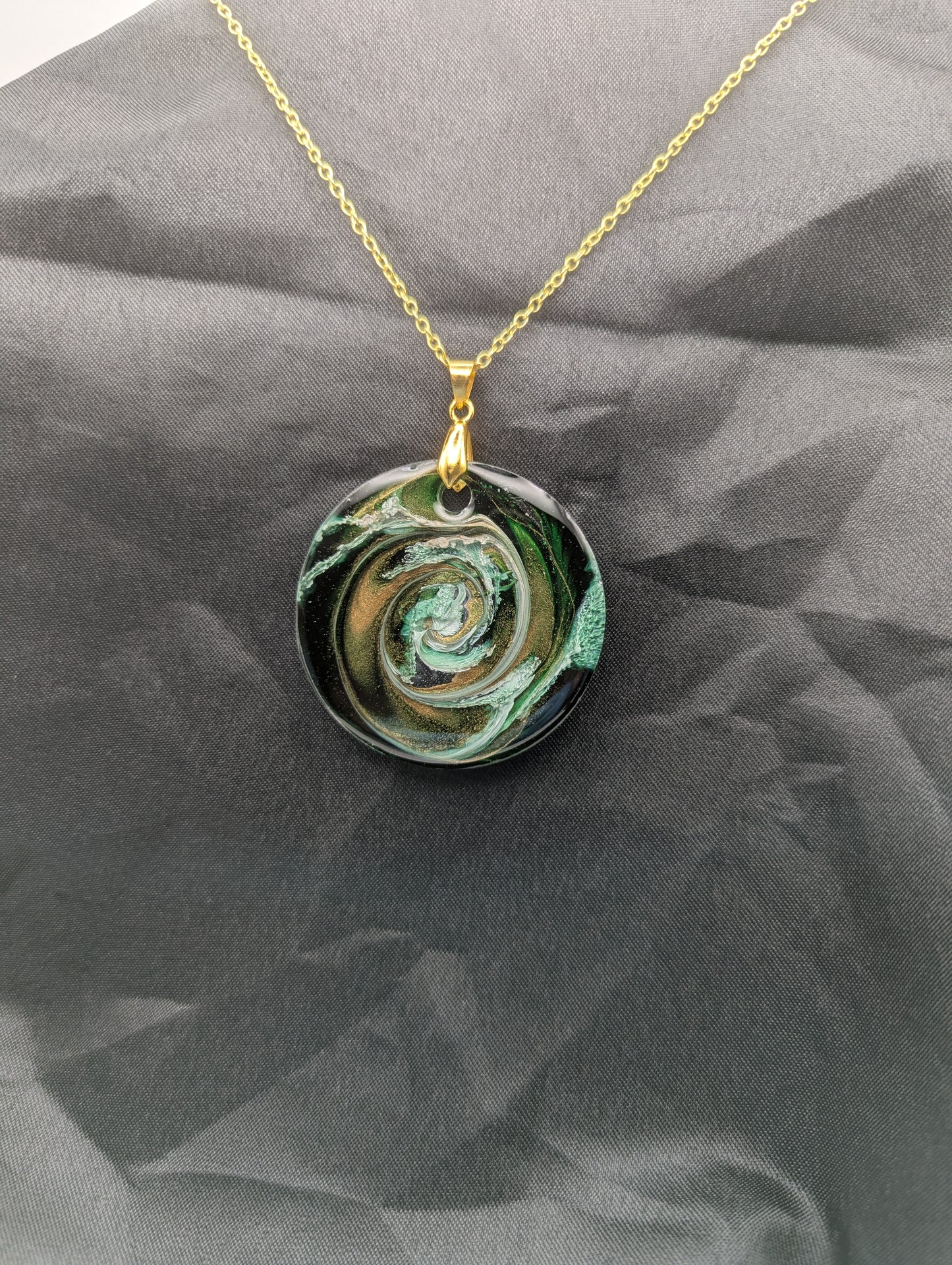 Green & Gold Swirl Circle Pendant on a gold pinch bail & gold plated stainless steel chain. Resin Circle Jewelry Pendant with Petri Effect.