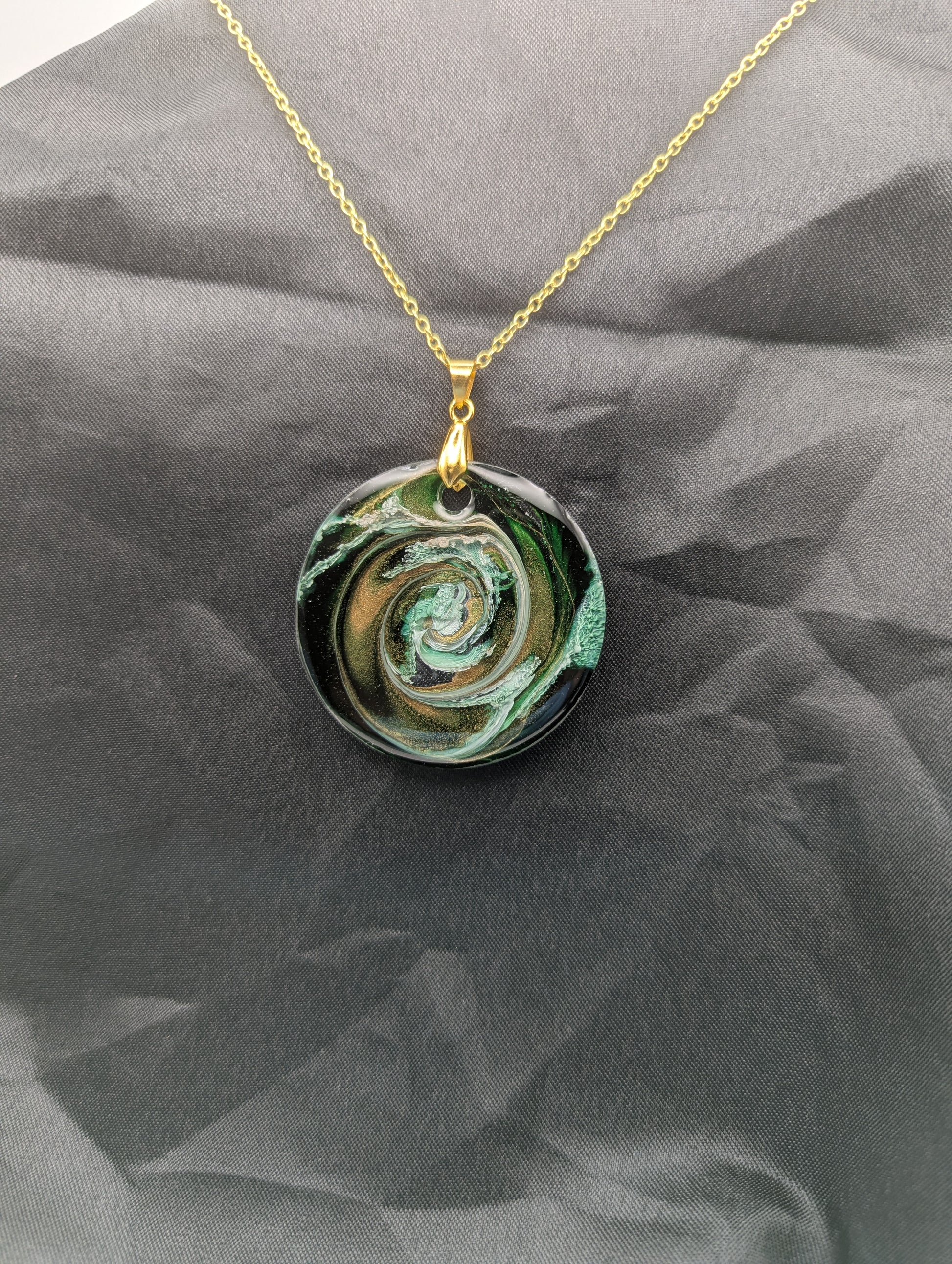 Green & Gold Swirl Circle Pendant on a gold pinch bail & gold plated stainless steel chain. Resin Circle Jewelry Pendant with Petri Effect.