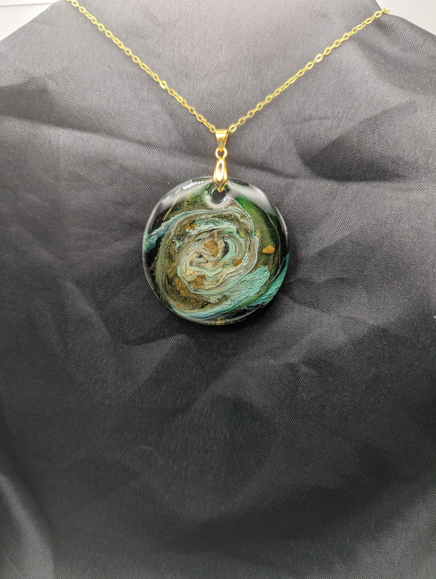 Green & Gold Swirl Circle Pendant on a gold pinch bail & gold plated metal chain. Resin Circle Jewelry Pendant with Petri Effect.