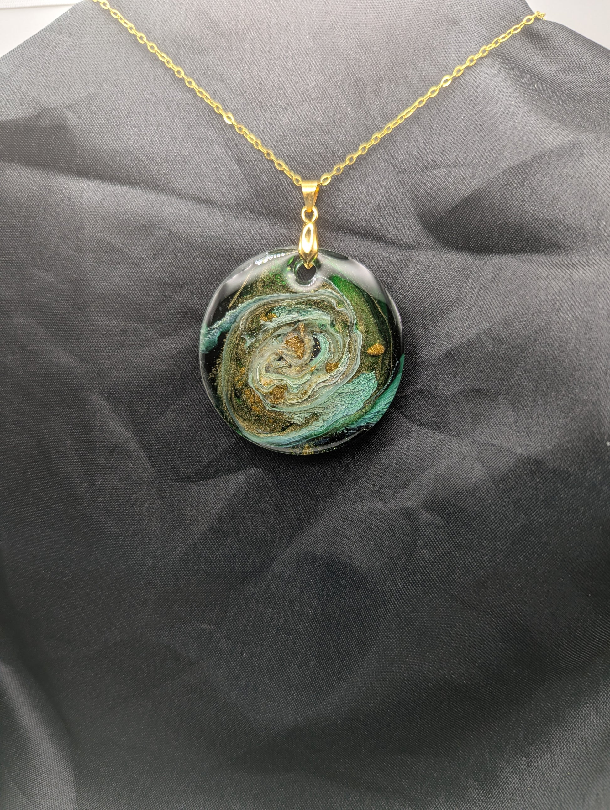 Green & Gold Swirl Circle Pendant on a gold pinch bail & gold plated metal chain. Resin Circle Jewelry Pendant with Petri Effect.