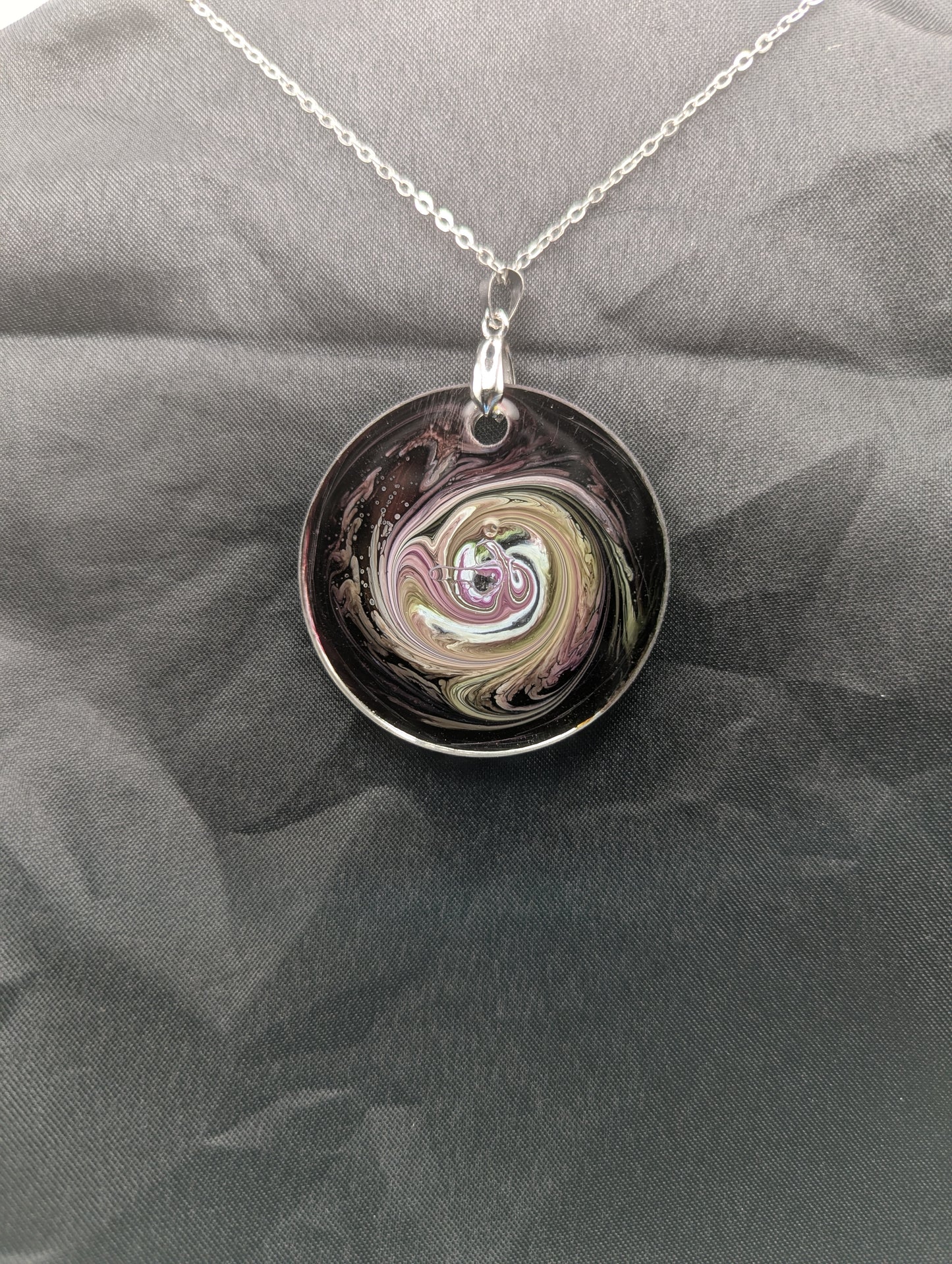 Back view of Purple & Yellow Swirl Circle Pendant on a silver pinch bail & stainless steel chain. Resin Circle Jewelry Pendant with Petri Effect.