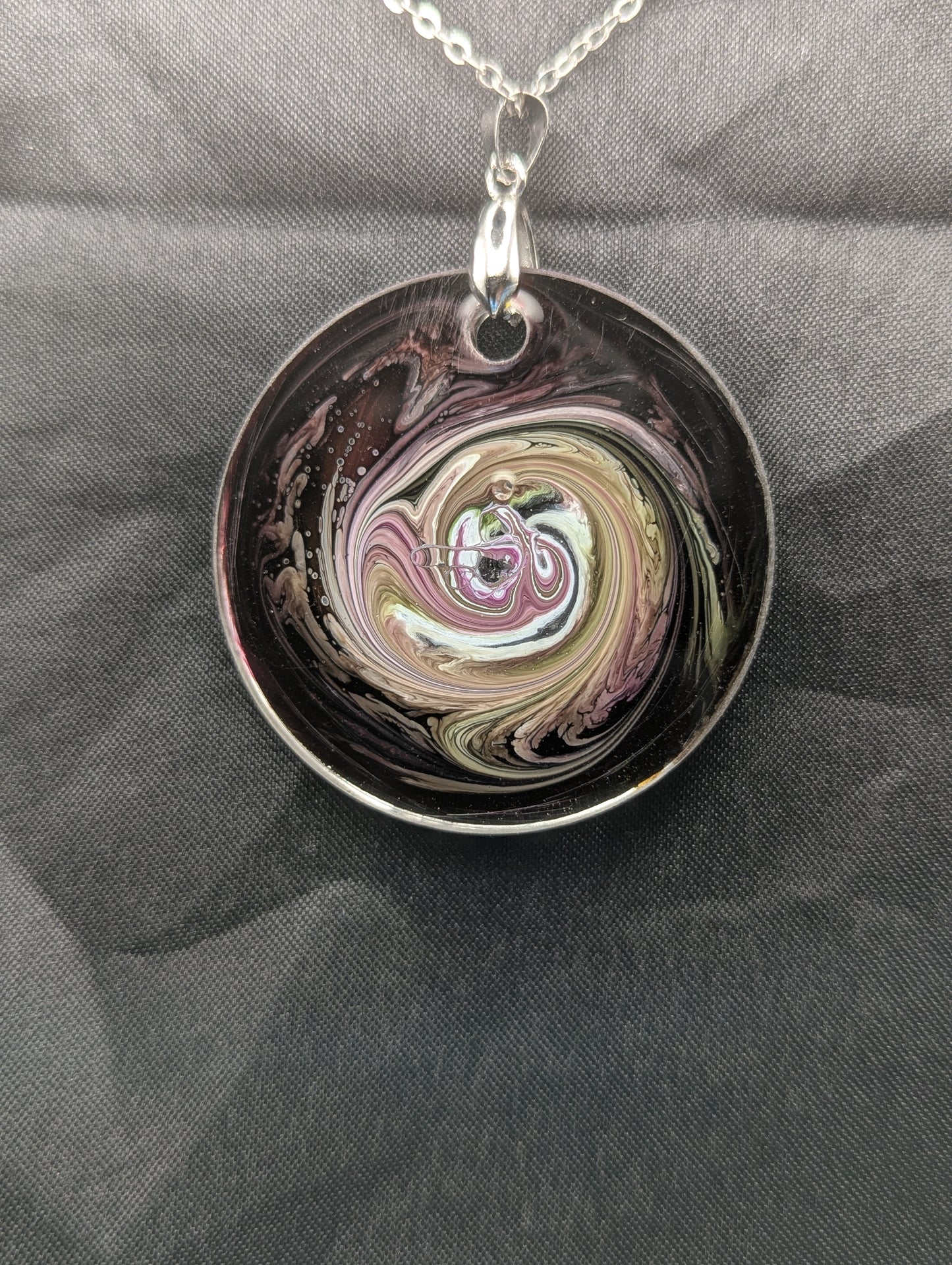Back view of Purple & Yellow Swirl Circle Pendant on a silver pinch bail & stainless steel chain. Resin Circle Jewelry Pendant with Petri Effect.