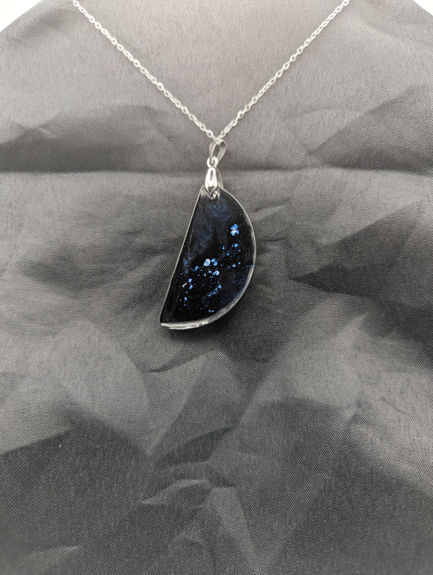 Back view of Black & Ghost Violet Swirl Half-Circle Pendant on a silver pinch bail & stainless steel chain