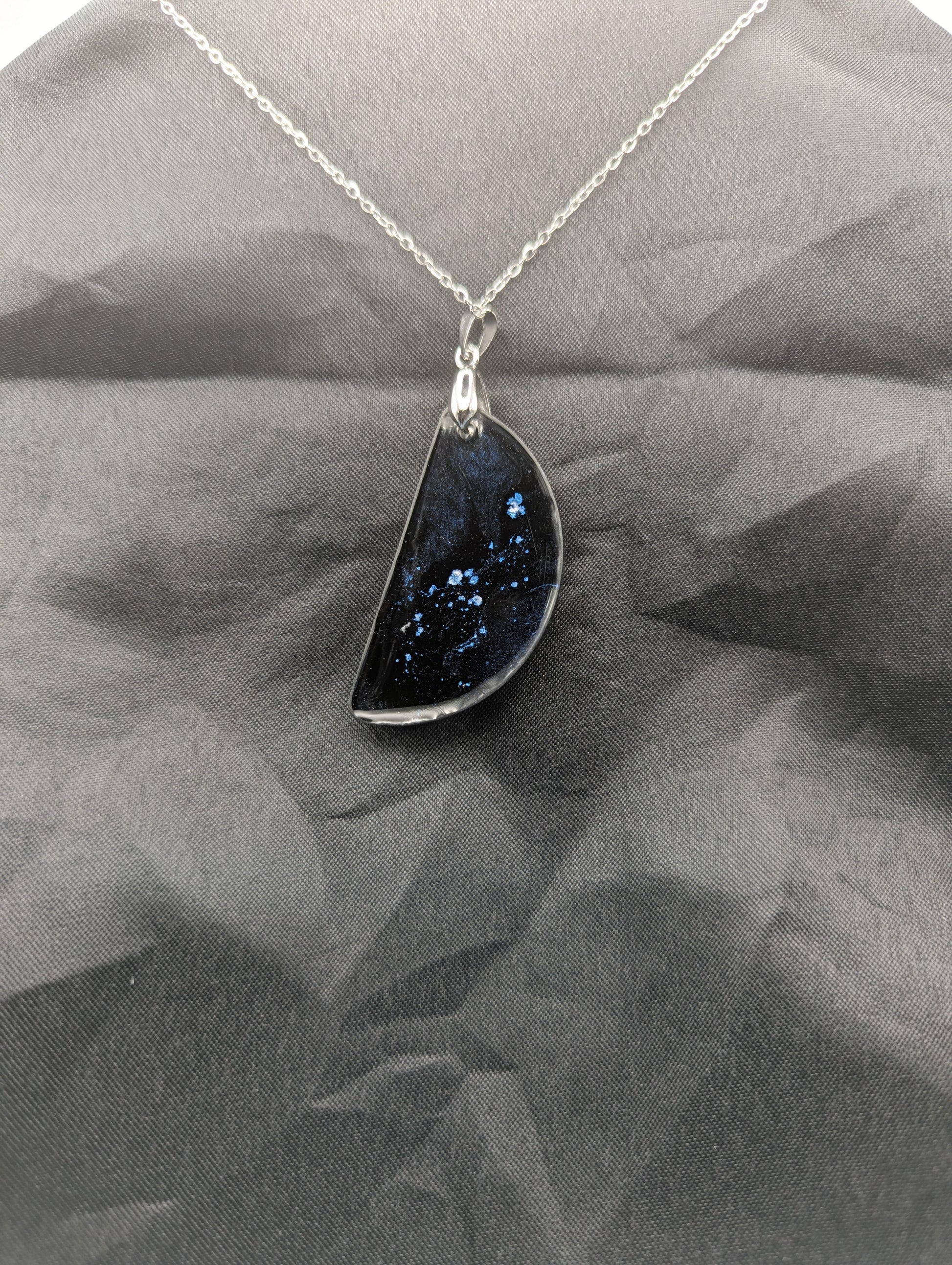 Back view of Black & Ghost Violet Swirl Half-Circle Pendant on a silver pinch bail & stainless steel chain