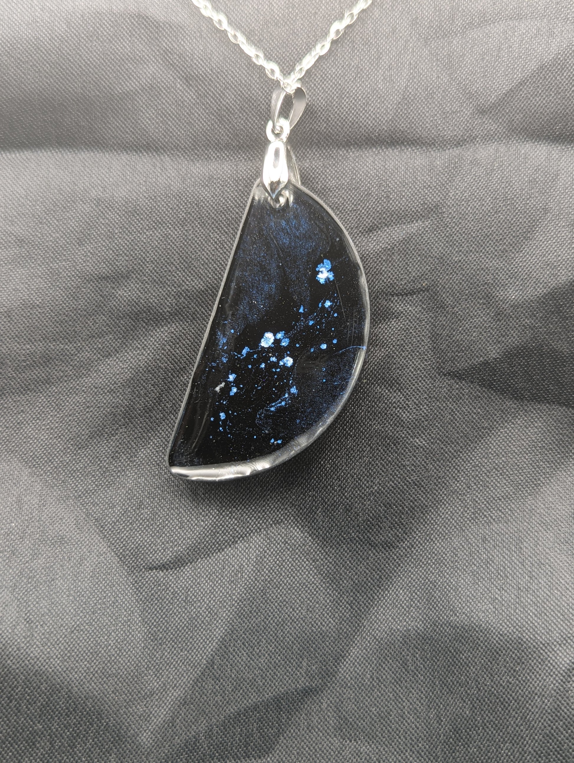 Back view of Black & Ghost Violet Swirl Half-Circle Pendant on a silver pinch bail & stainless steel chain