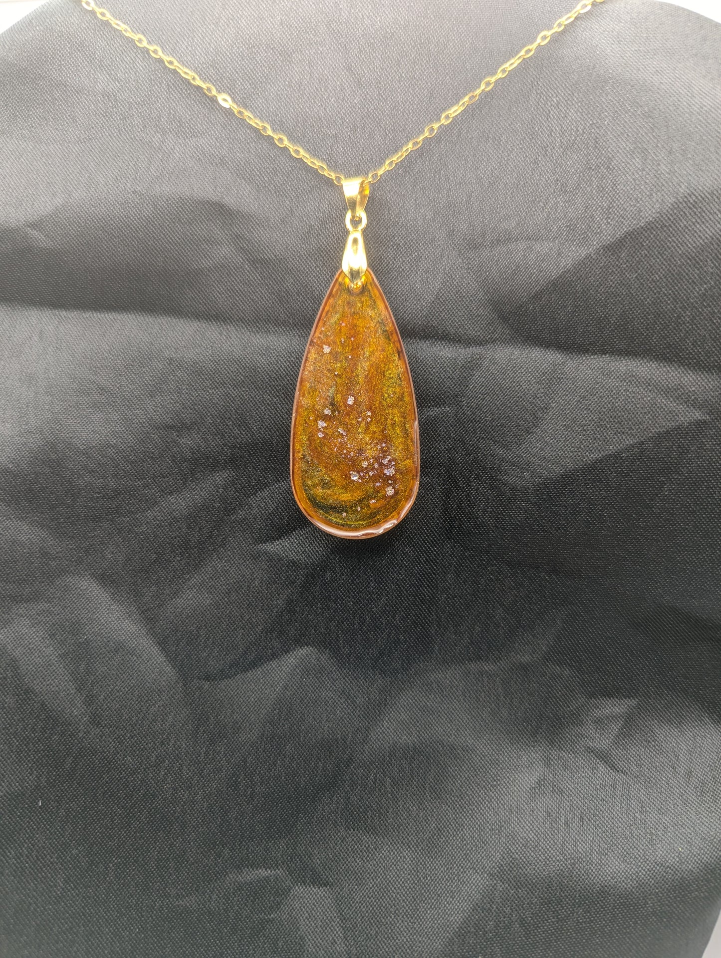 Back view of Yellow & Purple colored Teardrop Resin Pendant necklace with a gold pinch bail on a gold plated metal chain.