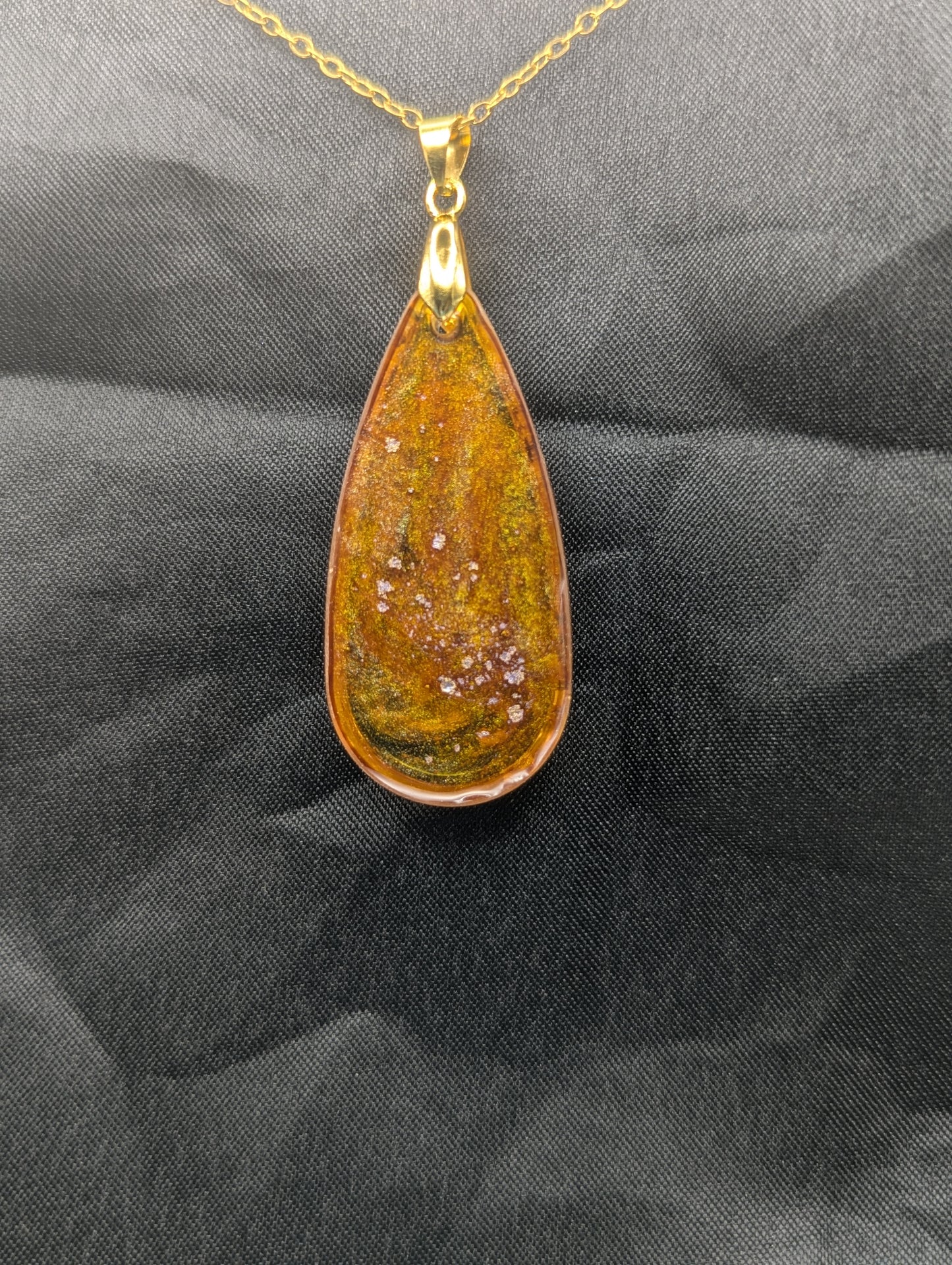 Back view of Yellow & Purple colored Teardrop Resin Pendant necklace with a gold pinch bail on a gold plated metal chain.