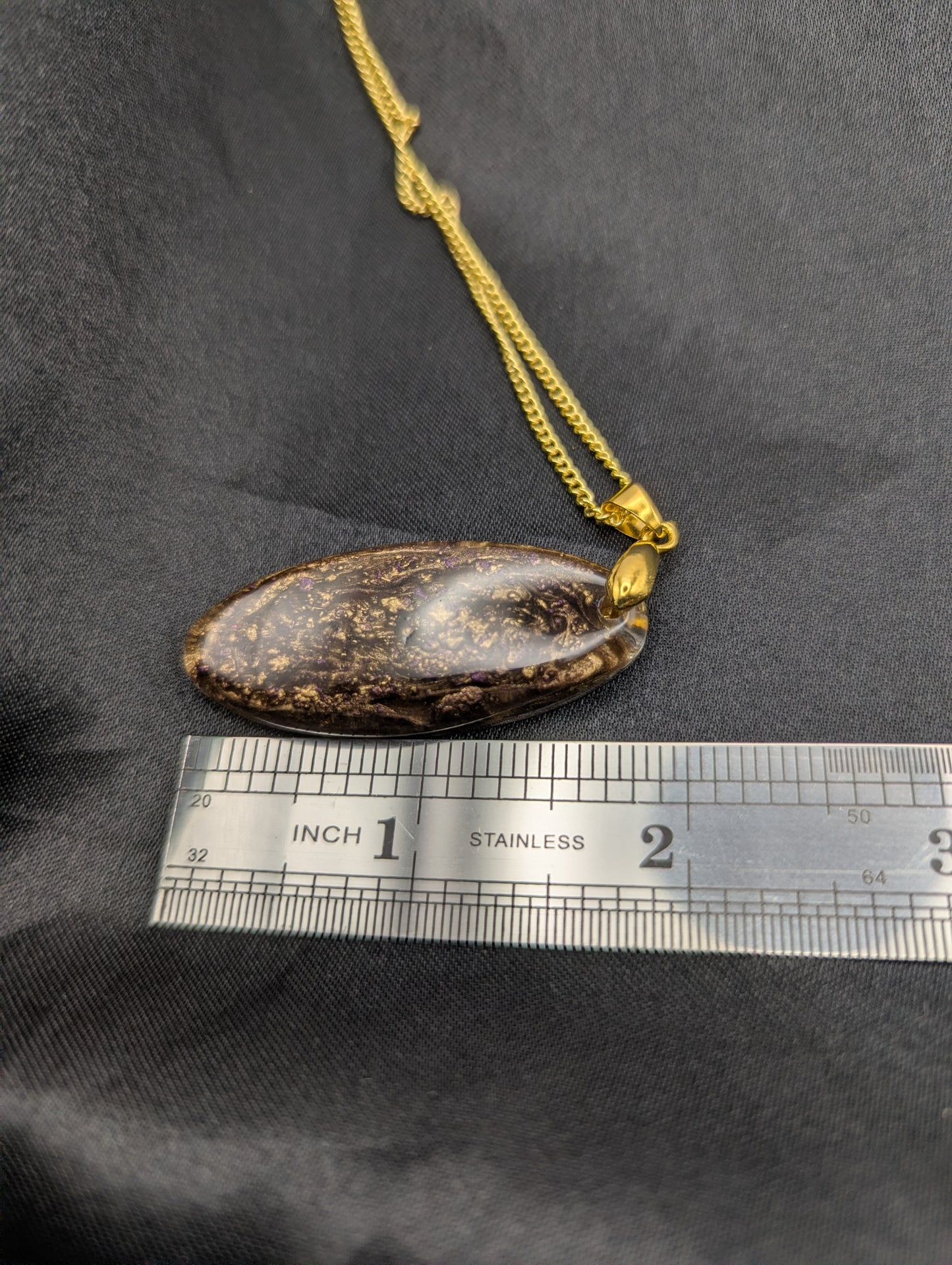 Size example pic of pendant size in inches, showing pendant is about 2 inches long