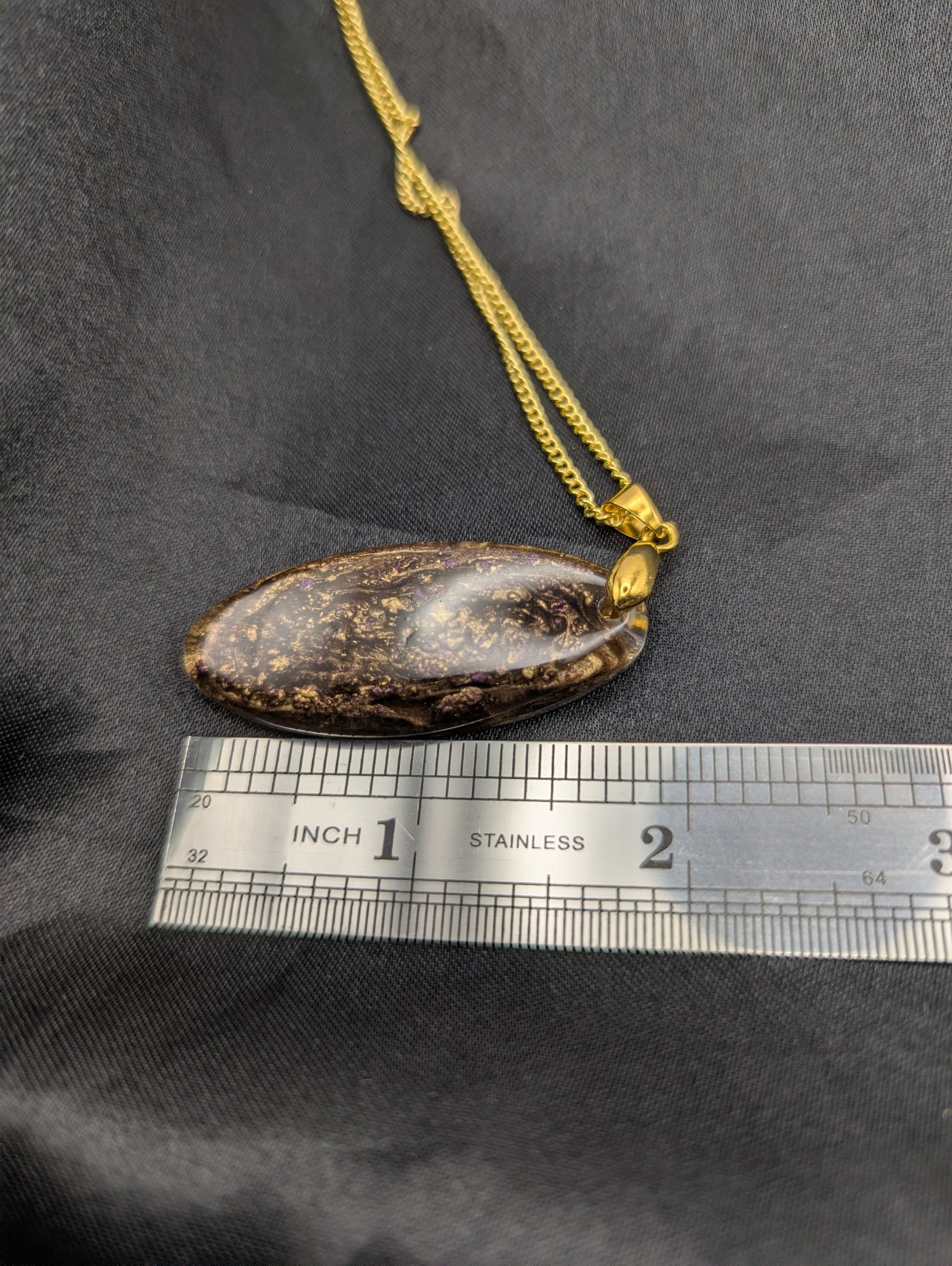 Size example pic of pendant size in inches, showing pendant is about 2 inches long