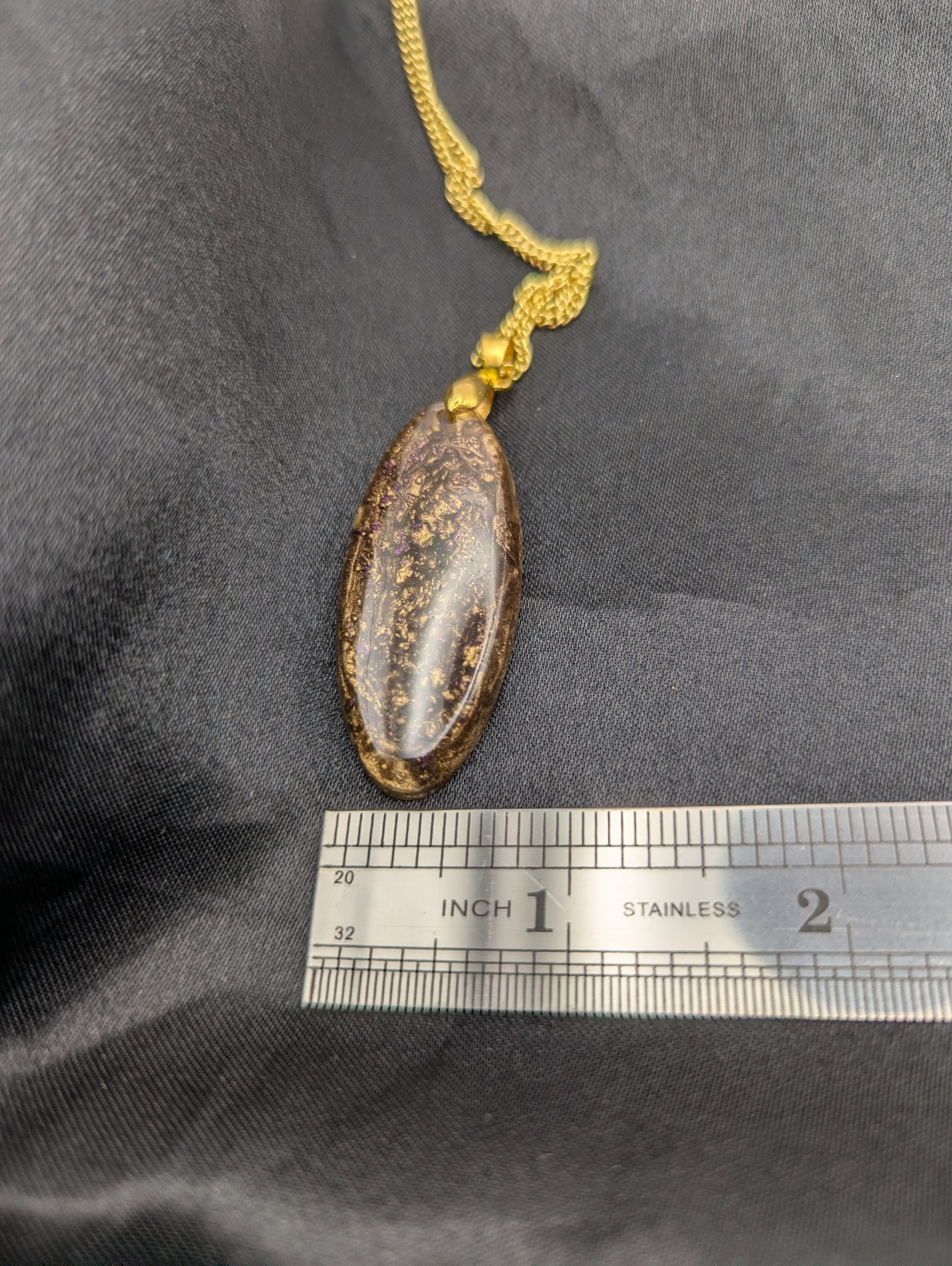 Size example pic of pendant size in inches, showing pendant is about 0.5 inches wide