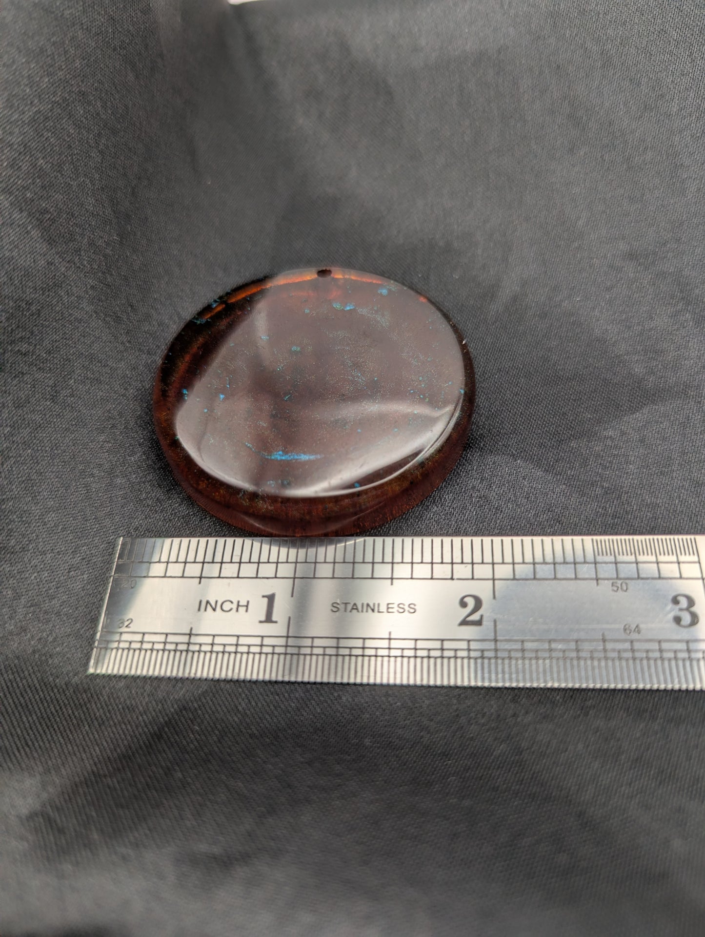 Size example pic of pendant size in inches, showing pendant is about 1.75 inches diameter.