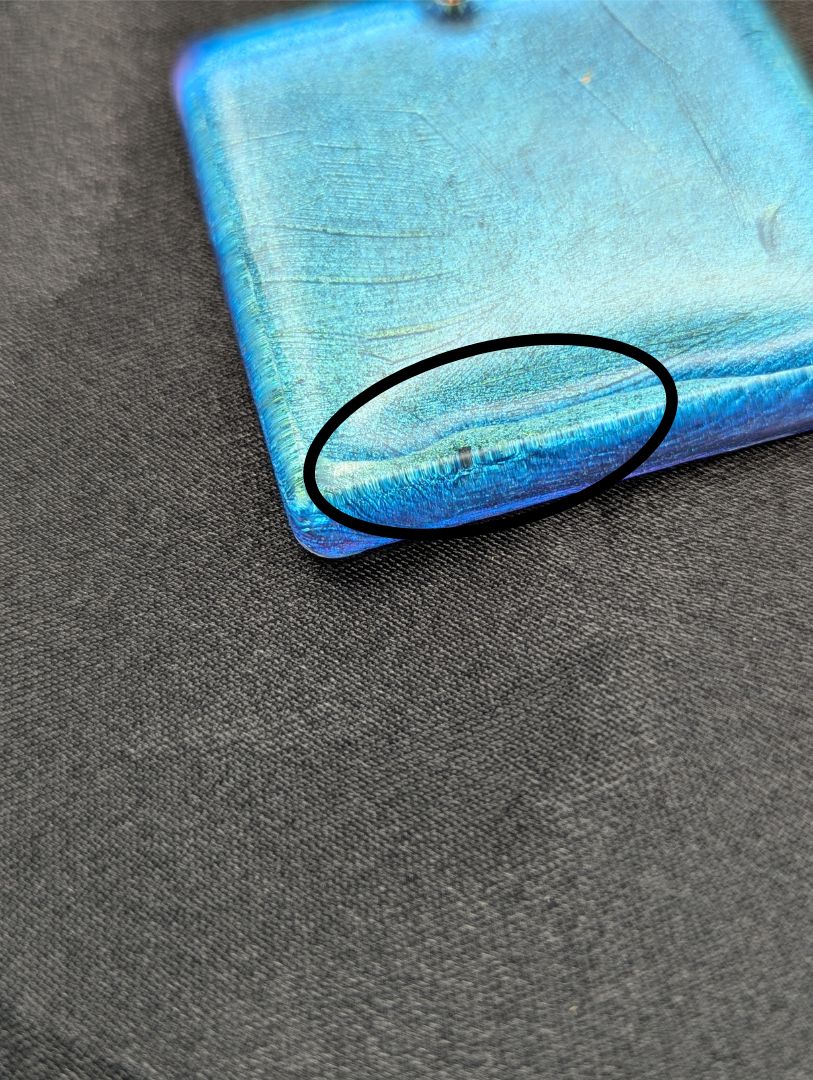 Blue square resin pendant with a color shift background. Resin square necklace on a pure copper wire wrapped bail & rose gold colored stainless steel plated metal chain.