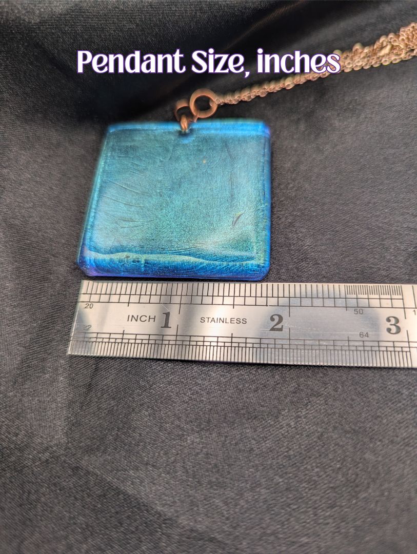 Size example pic of pendant size in inches, showing pendant is about 2 inches wide.