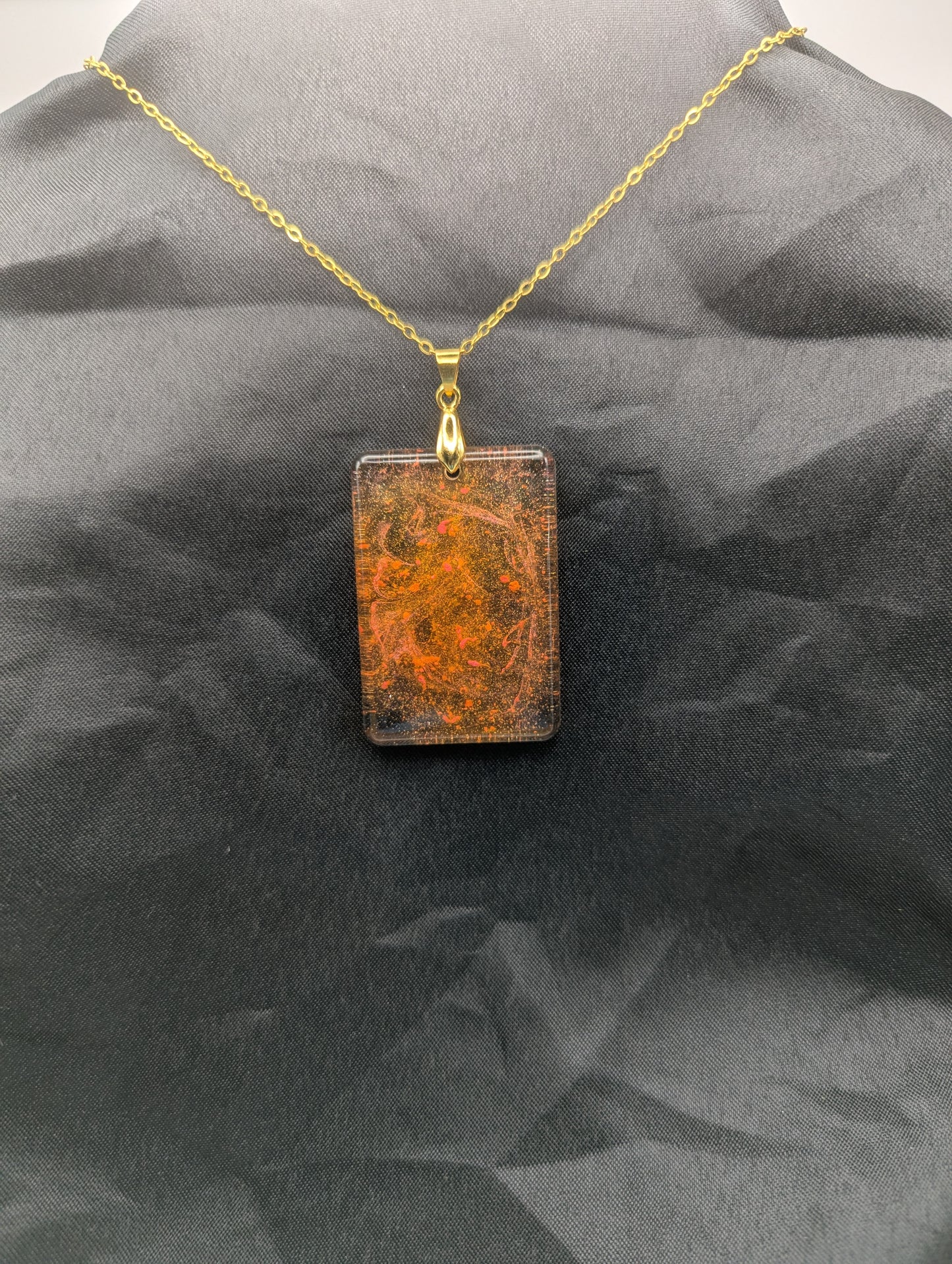 Yellow & Orange rectangle resin pendant necklace with a gold pinch bail on a gold plated metal chain.
