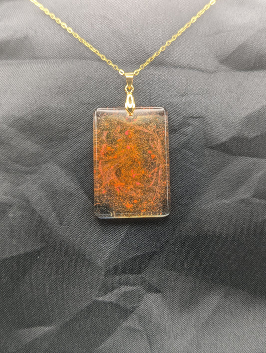 Yellow & Orange rectangle resin pendant necklace with a gold pinch bail on a gold plated metal chain.