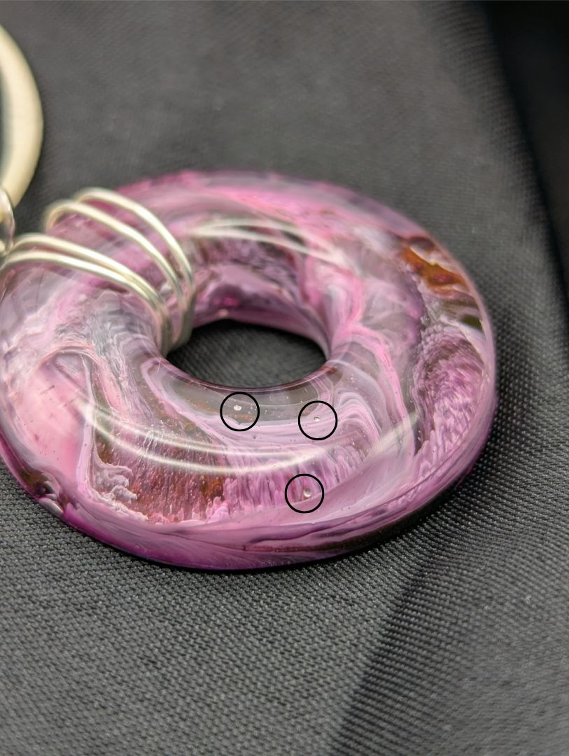 Wire Wrapped Donut Resin Pendant Necklace - Petri Effect with shades of purple, pink, & red swirls. Resin Necklace on a waxed cotton cord.