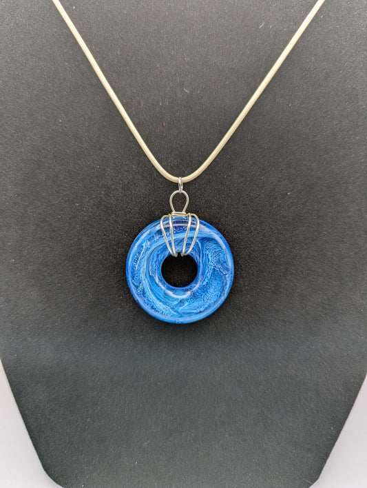 Wire Wrapped Donut Resin Pendant Necklace - Petri Effect with shades of blue. Resin Necklace on a waxed cotton cord.