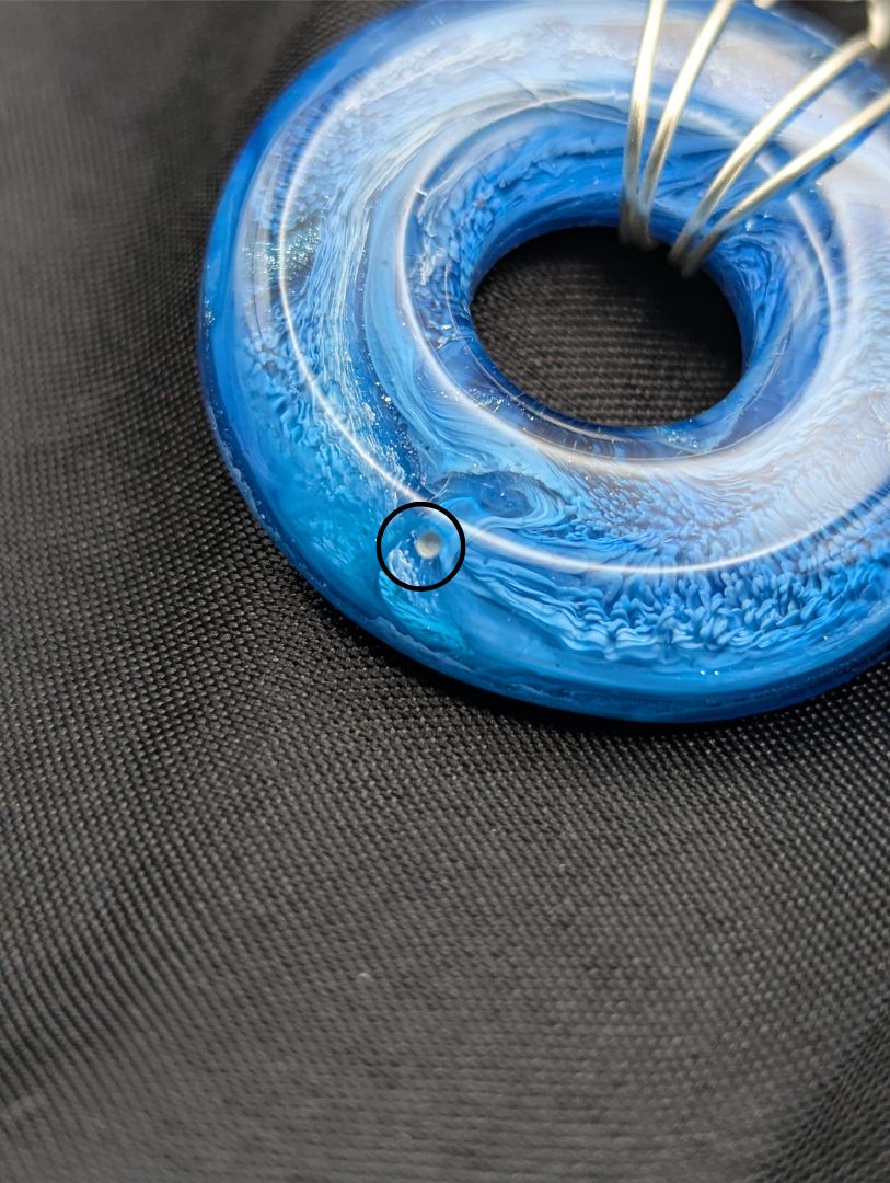Wire Wrapped Donut Resin Pendant Necklace - Petri Effect with shades of blue. Resin Necklace on a waxed cotton cord.