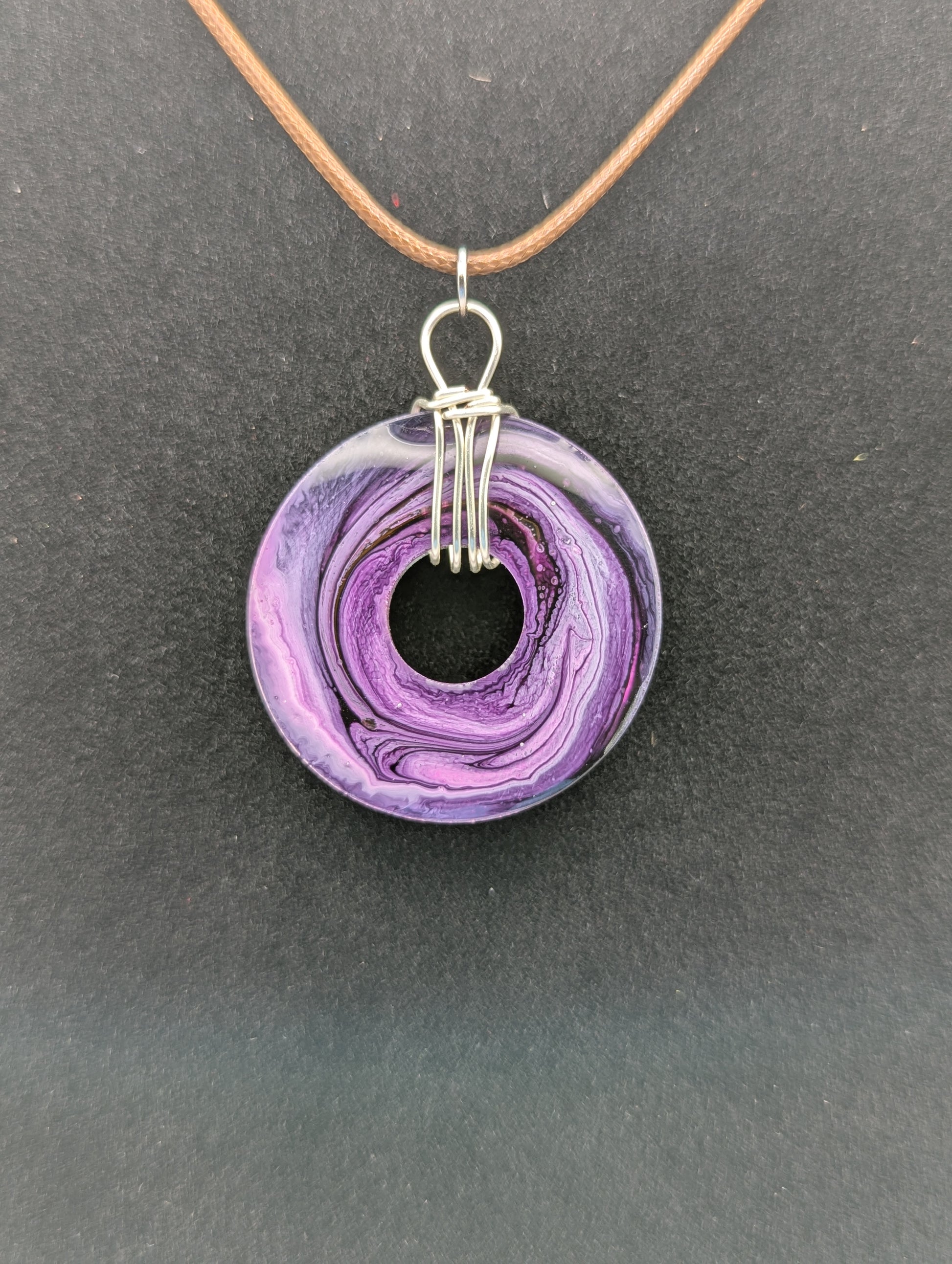 Back View of Wire Wrapped Donut Resin Pendant Necklace - Petri Effect with shades of purple & pink. Resin Necklace on a waxed cotton cord.