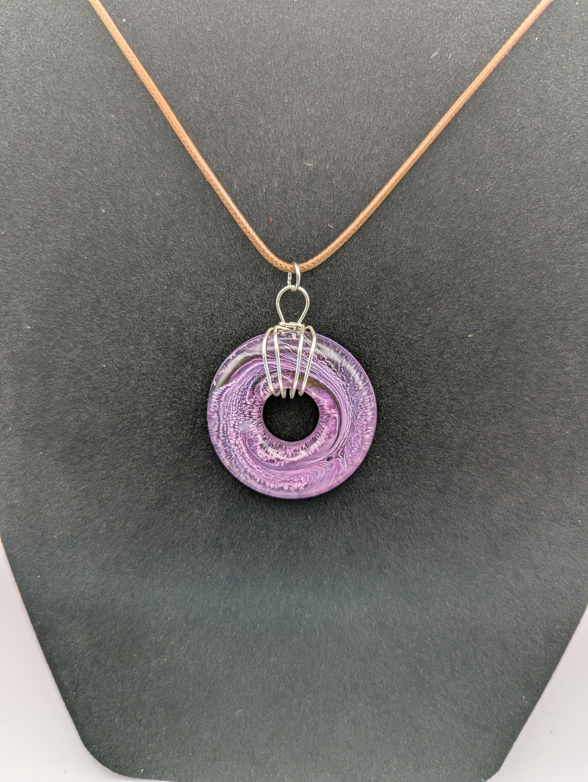 Wire Wrapped Donut Resin Pendant Necklace - Petri Effect with shades of purple & pink. Resin Necklace on a waxed cotton cord.