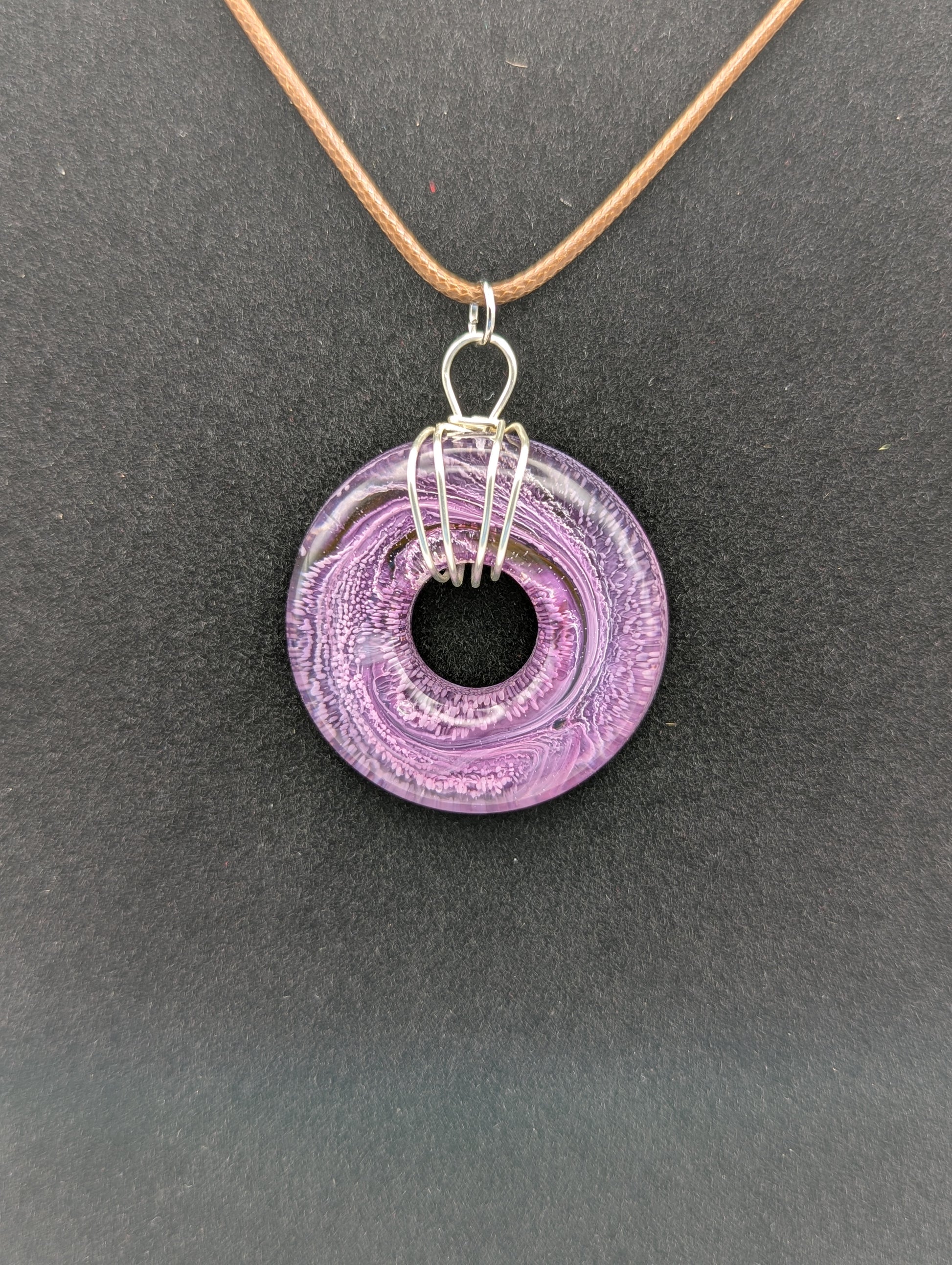 Wire Wrapped Donut Resin Pendant Necklace - Petri Effect with shades of purple & pink. Resin Necklace on a waxed cotton cord.