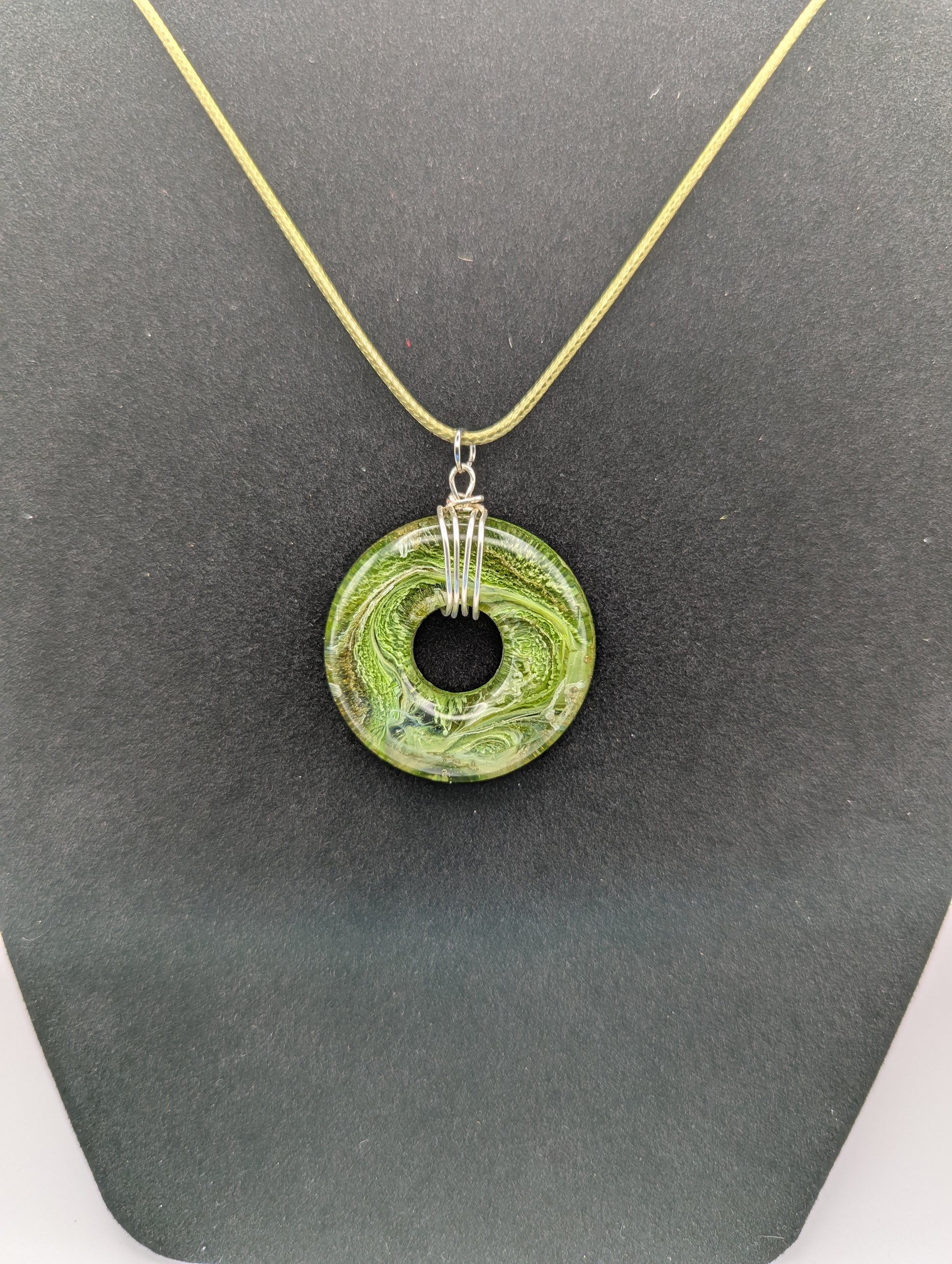 Wire Wrapped Donut Resin Pendant Necklace - Petri Effect with shades of green. Resin Necklace on a waxed cotton cord.