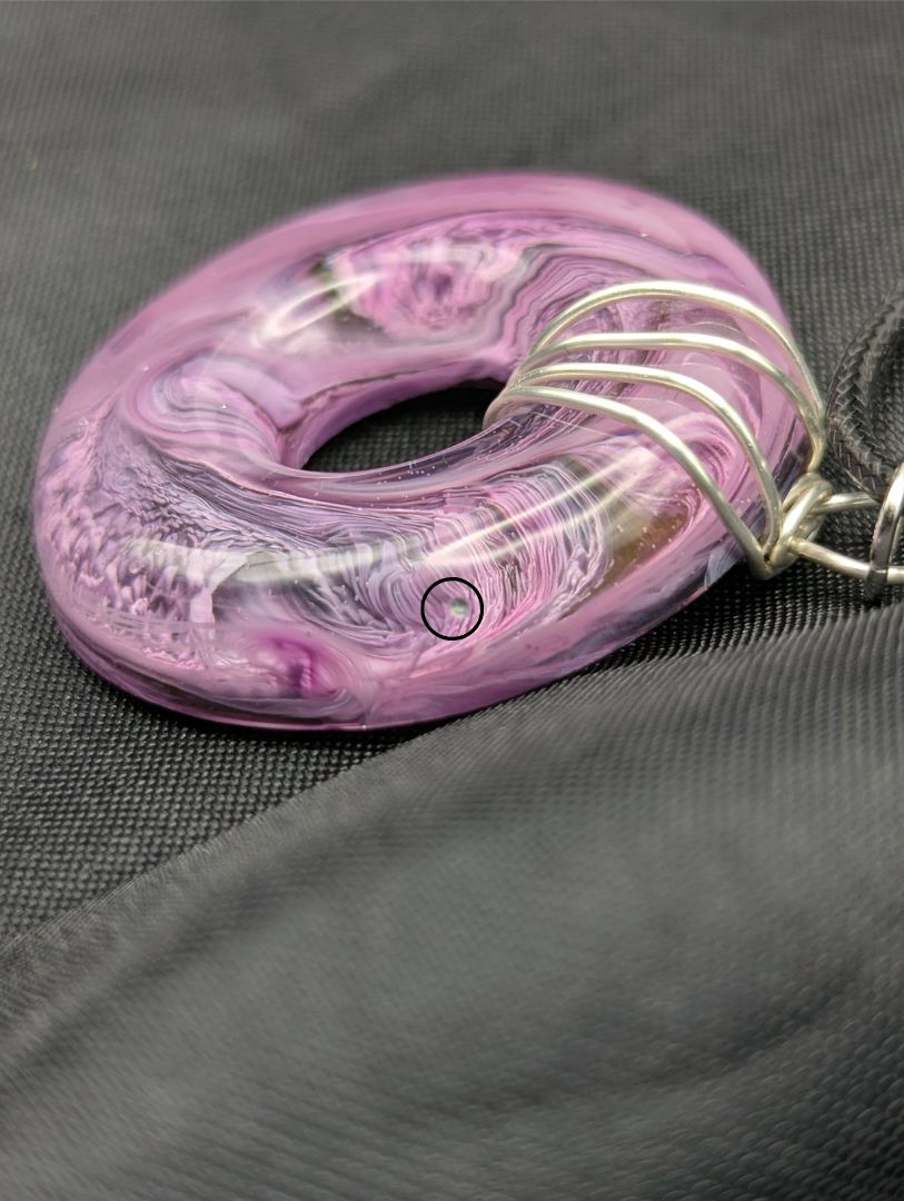 Wire Wrapped Donut Resin Pendant Necklace - Petri Effect with shades of purple. Resin Necklace on a waxed cotton cord.