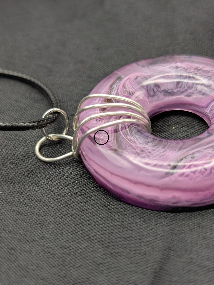 Wire Wrapped Donut Resin Pendant Necklace - Petri Effect with shades of purple. Resin Necklace on a waxed cotton cord.