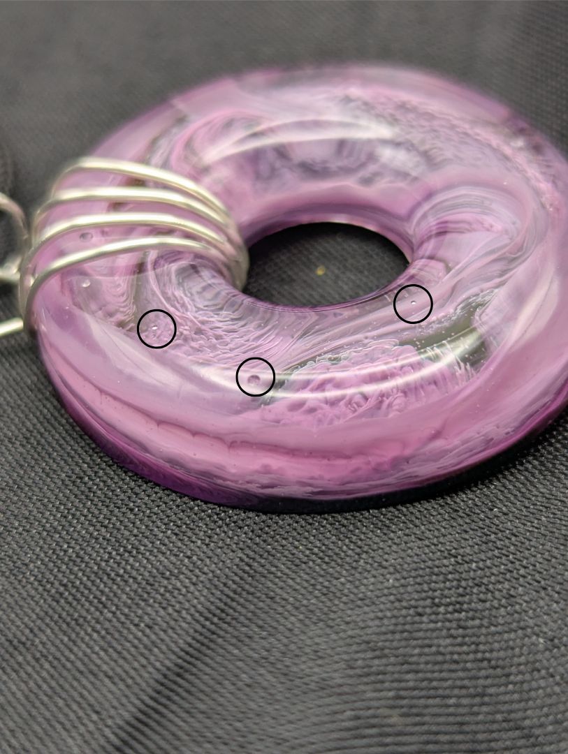 Wire Wrapped Donut Resin Pendant Necklace - Petri Effect with shades of purple. Resin Necklace on a waxed cotton cord.