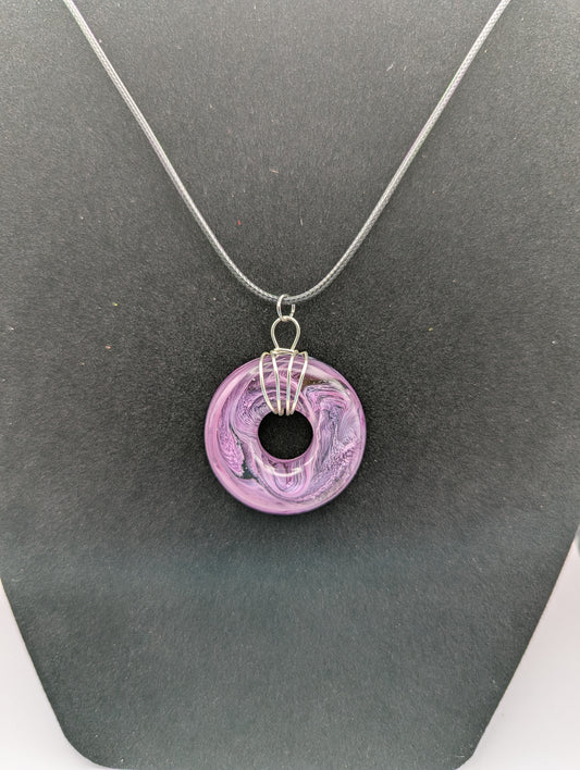 Wire Wrapped Donut Resin Pendant Necklace - Petri Effect with shades of purple. Resin Necklace on a waxed cotton cord.