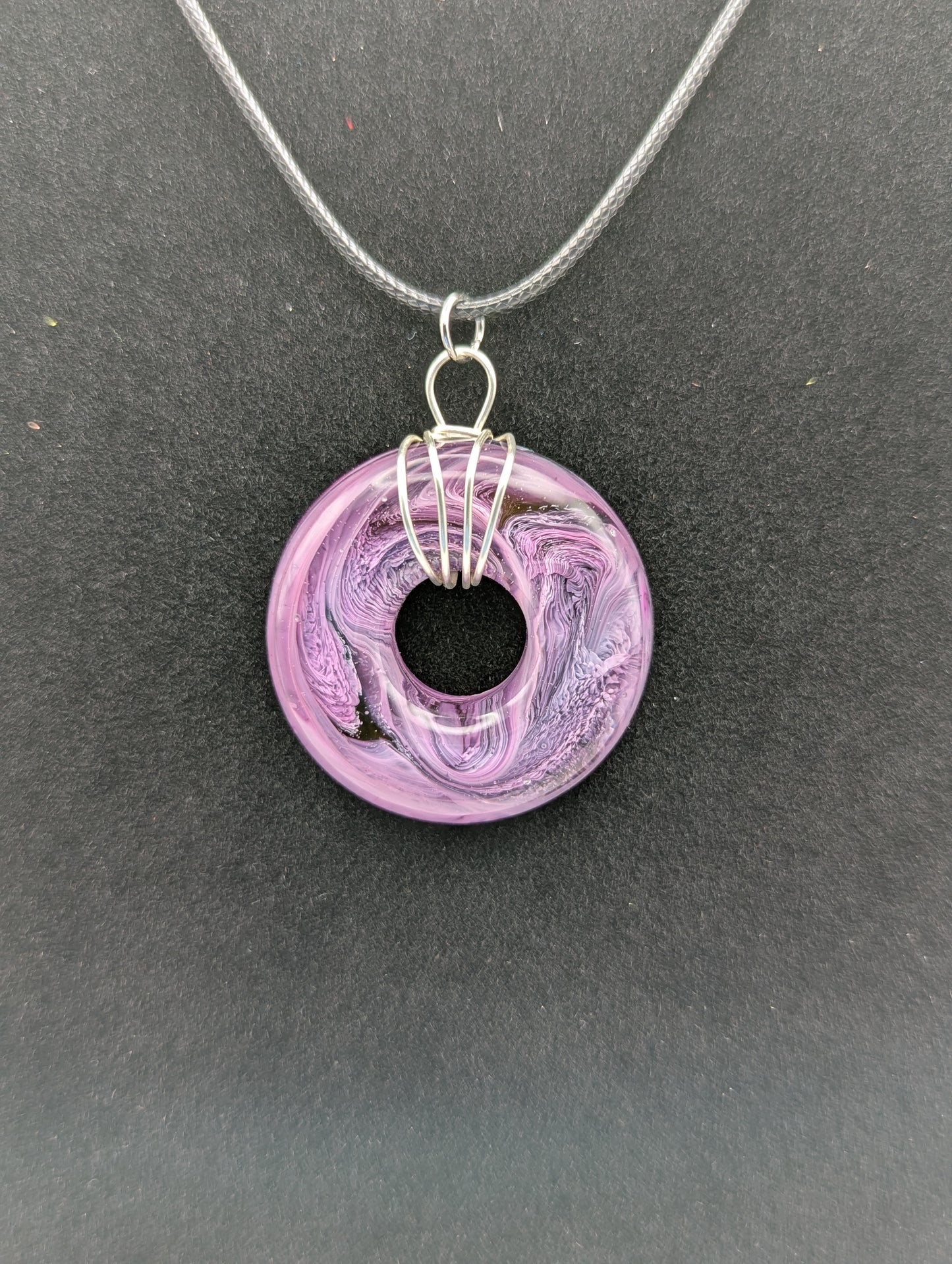 Wire Wrapped Donut Resin Pendant Necklace - Petri Effect with shades of purple. Resin Necklace on a waxed cotton cord.