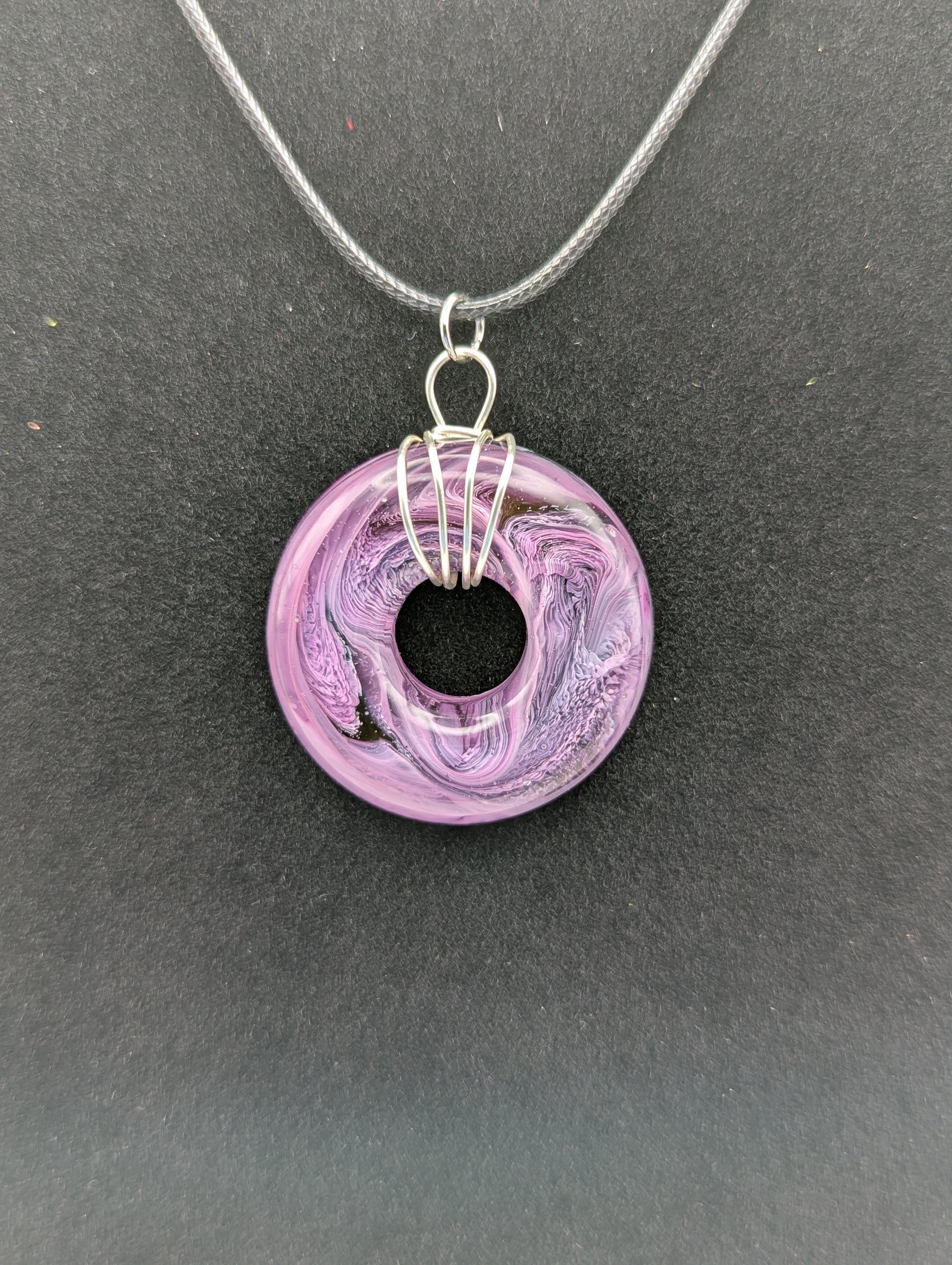 Wire Wrapped Donut Resin Pendant Necklace - Petri Effect with shades of purple. Resin Necklace on a waxed cotton cord.