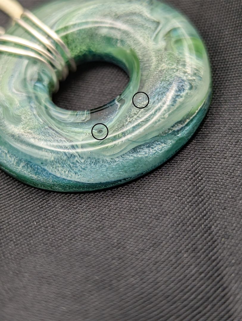 Wire Wrapped Donut Resin Pendant Necklace - Petri Effect with shades of blue, green, & yellow swirls. Resin Necklace on a waxed cotton cord.