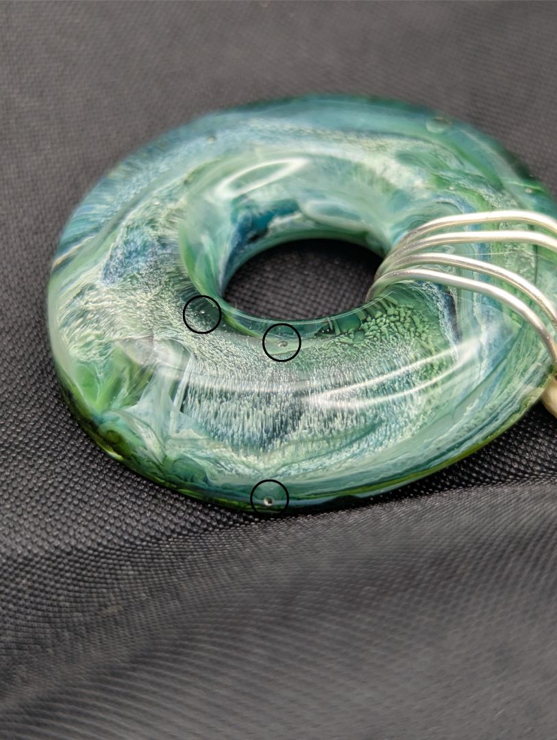 Wire Wrapped Donut Resin Pendant Necklace - Petri Effect with shades of blue, green, & yellow swirls. Resin Necklace on a waxed cotton cord.