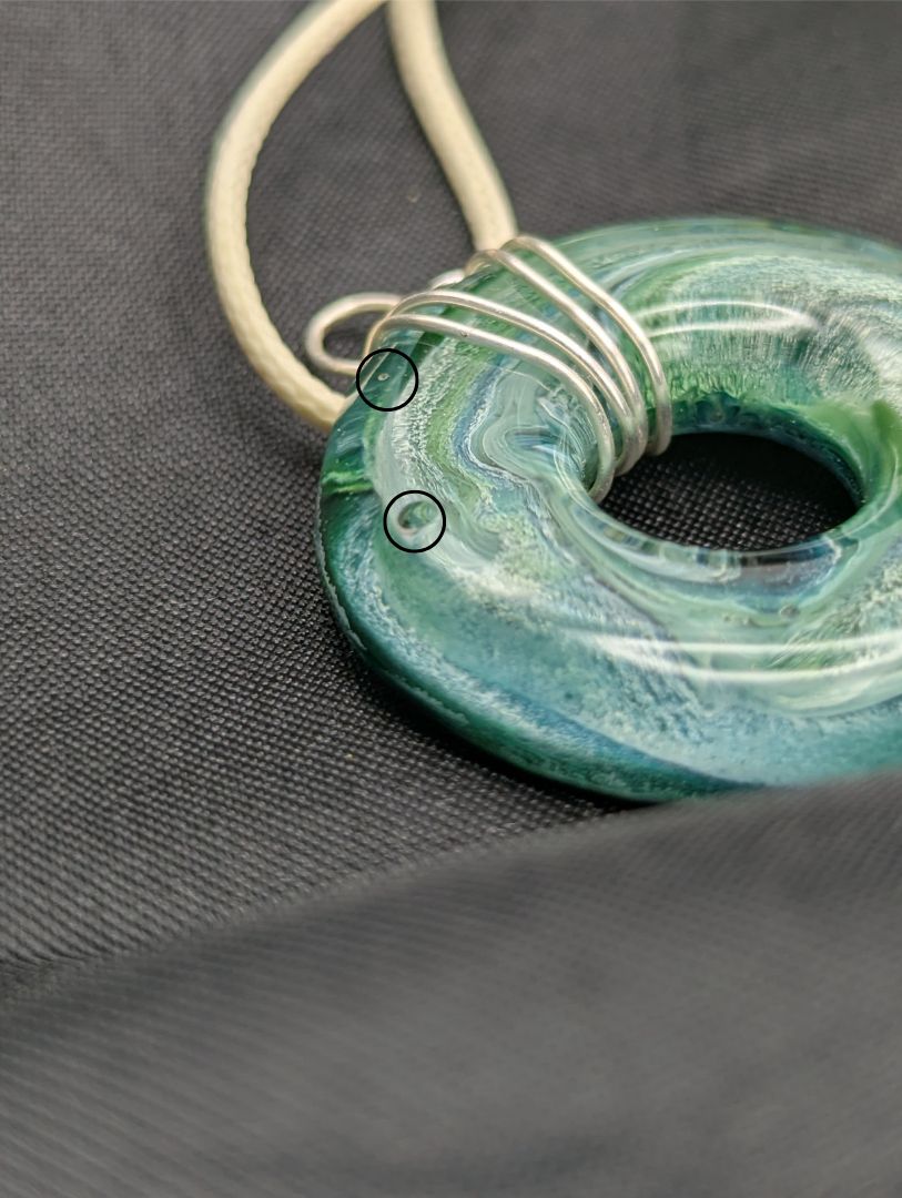 Wire Wrapped Donut Resin Pendant Necklace - Petri Effect with shades of blue, green, & yellow swirls. Resin Necklace on a waxed cotton cord.