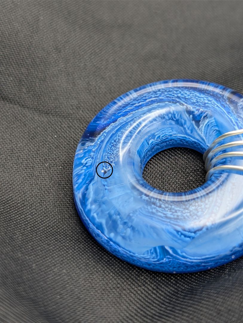 Wire Wrapped Donut Resin Pendant Necklace - Petri Effect with shades of blue swirls. Resin Necklace on a waxed cotton cord.