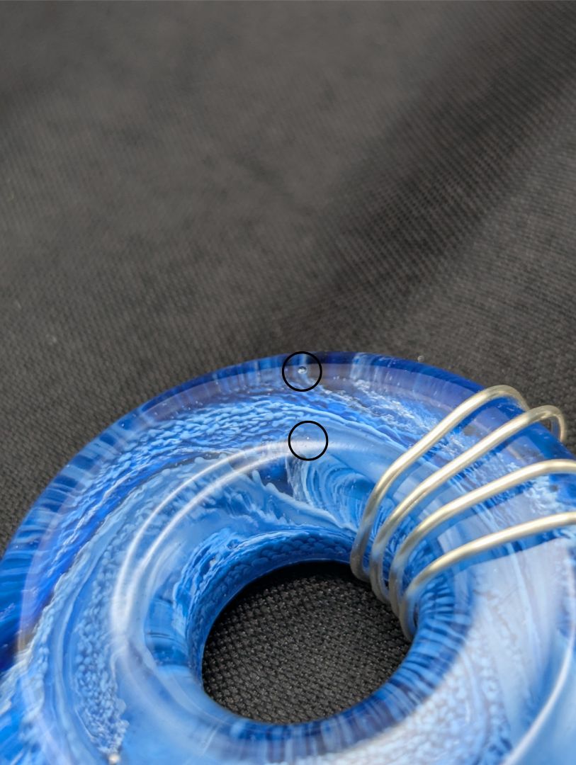 Wire Wrapped Donut Resin Pendant Necklace - Petri Effect with shades of blue swirls. Resin Necklace on a waxed cotton cord.