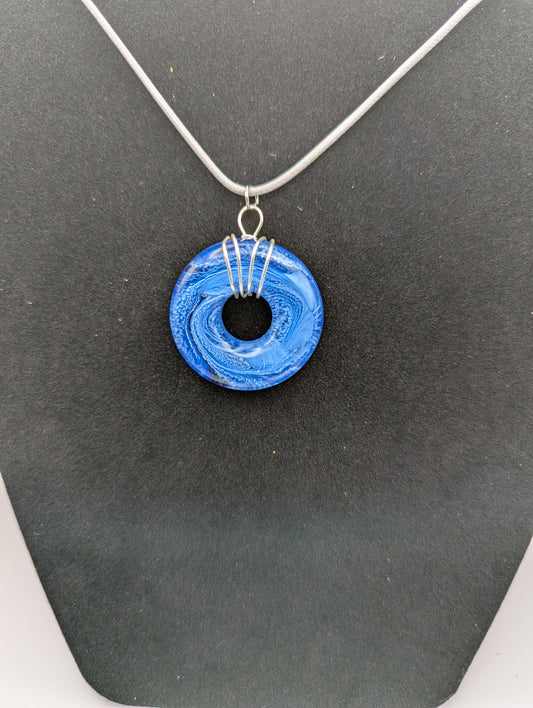 Wire Wrapped Donut Resin Pendant Necklace - Petri Effect with shades of blue swirls. Resin Necklace on a waxed cotton cord.